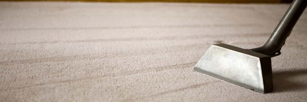 This is a photo of a carpet steam cleaner cleaning a cream carpet works carried out by Hendon Carpet Cleaning