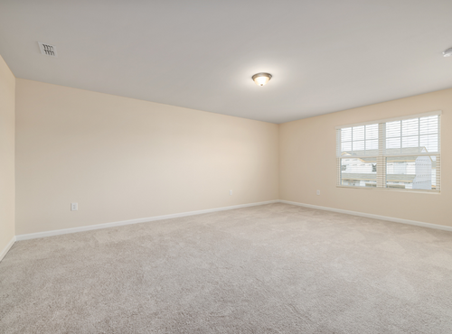 This is a photo of an empty room with cream carpets works carried out by Hendon Carpet Cleaning